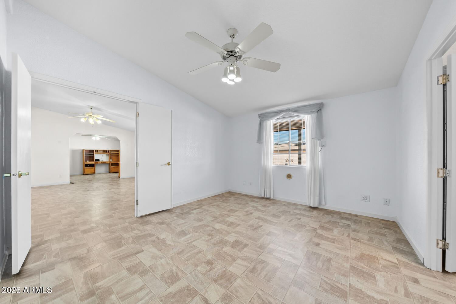 17200 West Bell Road, Unit 2251 Surprise, AZ 85374 - Photo 23 of 35 a view of an empty room with a ceiling fan