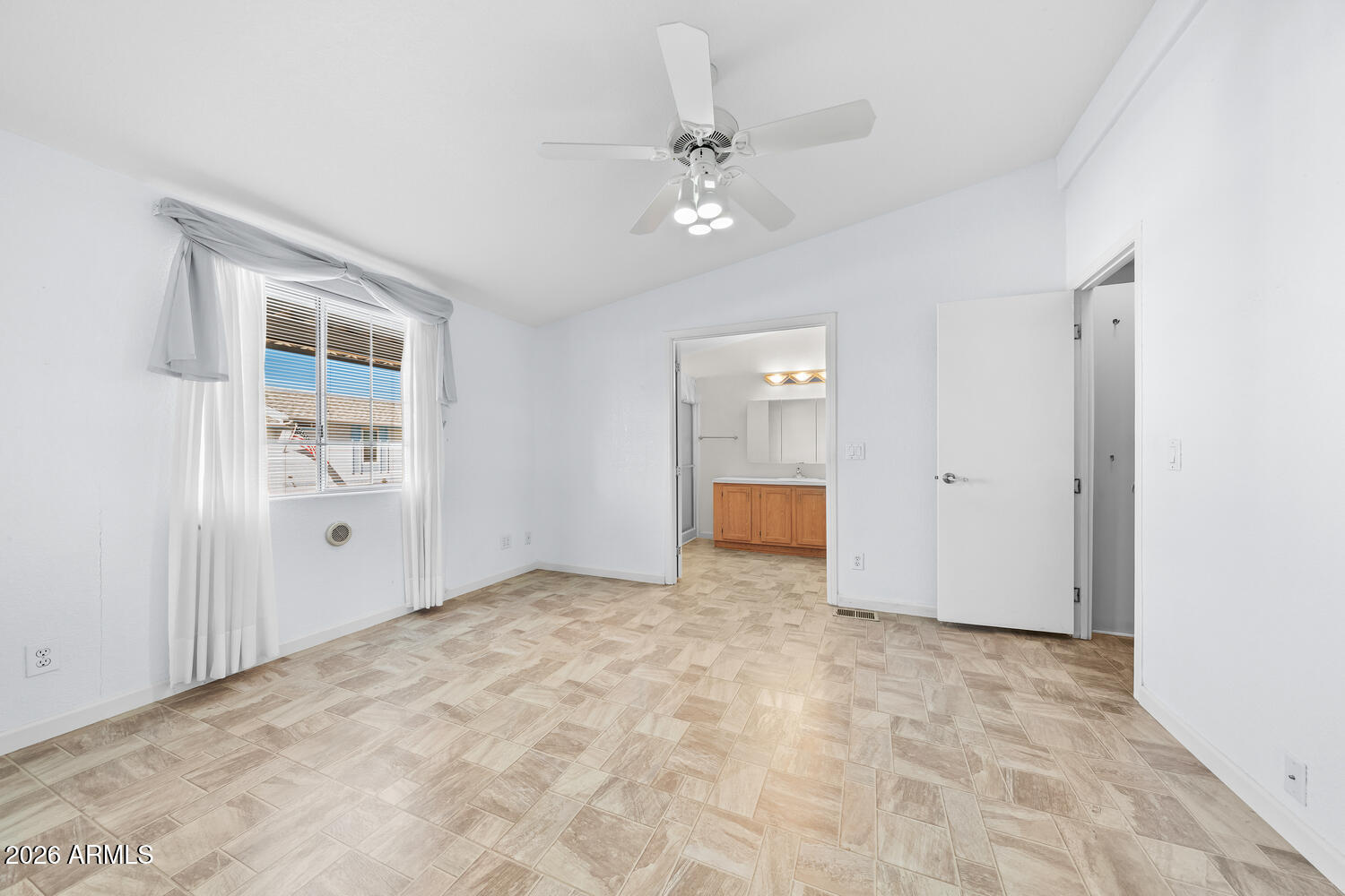 17200 West Bell Road, Unit 2251 Surprise, AZ 85374 - Photo 24 of 35 a view of an empty room with a window