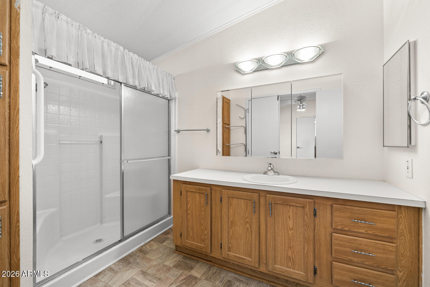 17200 West Bell Road, Unit 2251 Surprise, AZ 85374 - Photo 25 of 35 a bathroom with a granite countertop sink mirror and double