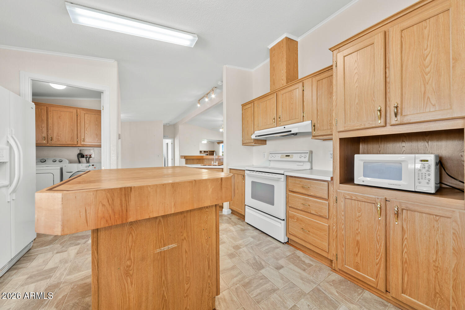 17200 West Bell Road, Unit 2251 Surprise, AZ 85374 - Photo 9 of 35 a kitchen with stainless steel appliances granite countertop a sink a stove and a refrigerator