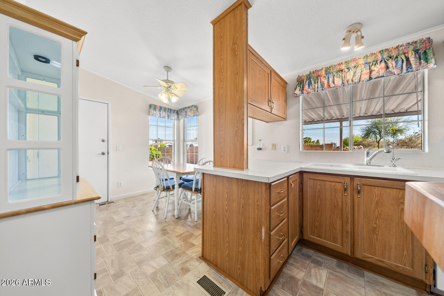 17200 West Bell Road, Unit 2251 Surprise, AZ 85374 - Photo 10 of 35 a kitchen with a sink and cabinets