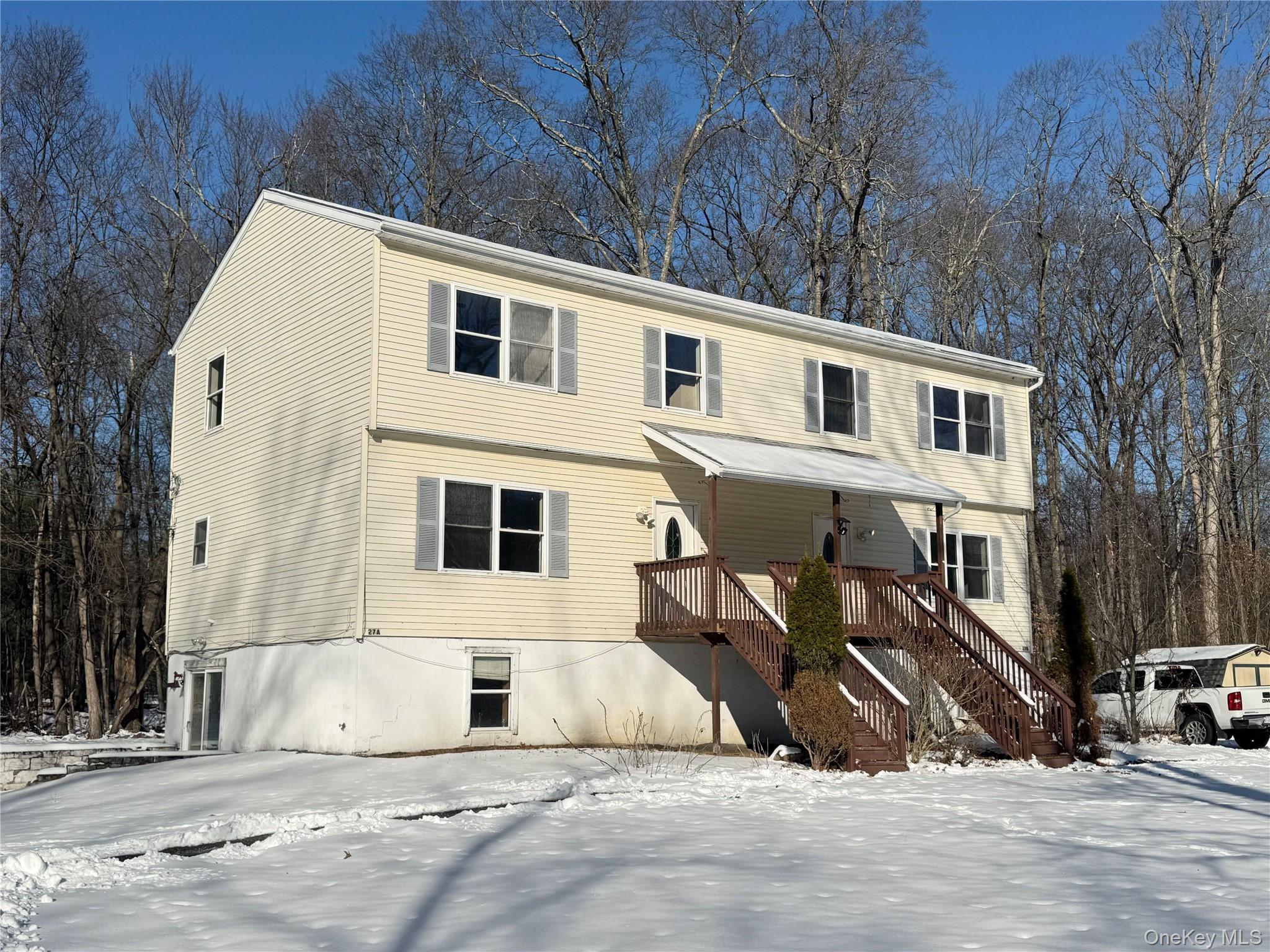 View of front of home featuring stairway