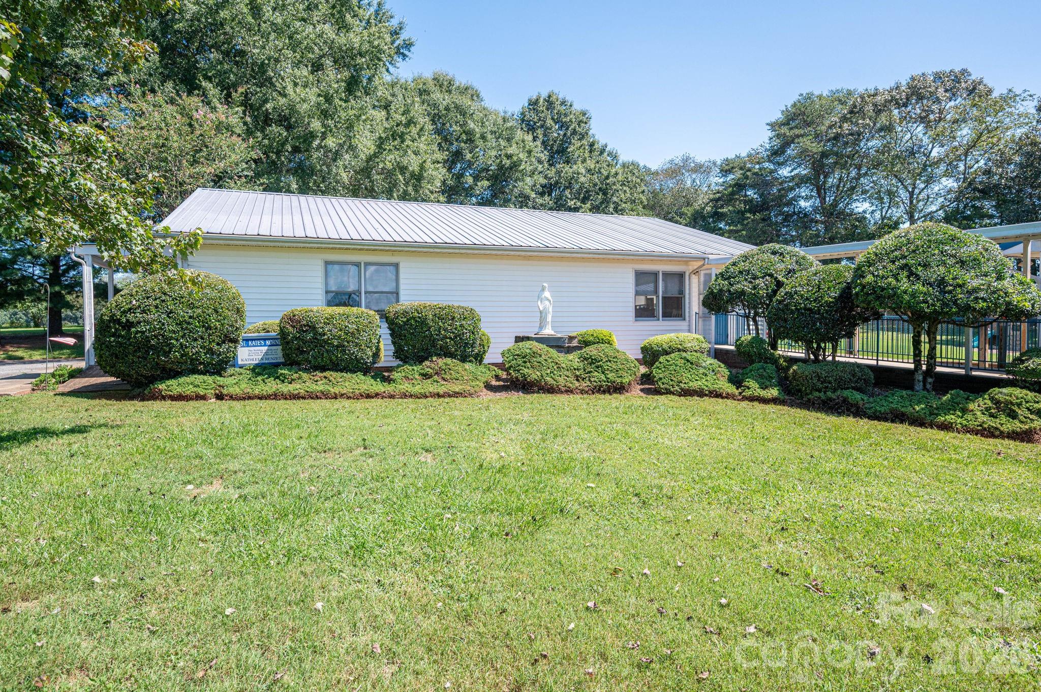 2482 June Bug Road Vale, NC 28168 - Photo 13 of 34 a view of a house with yard and a garden