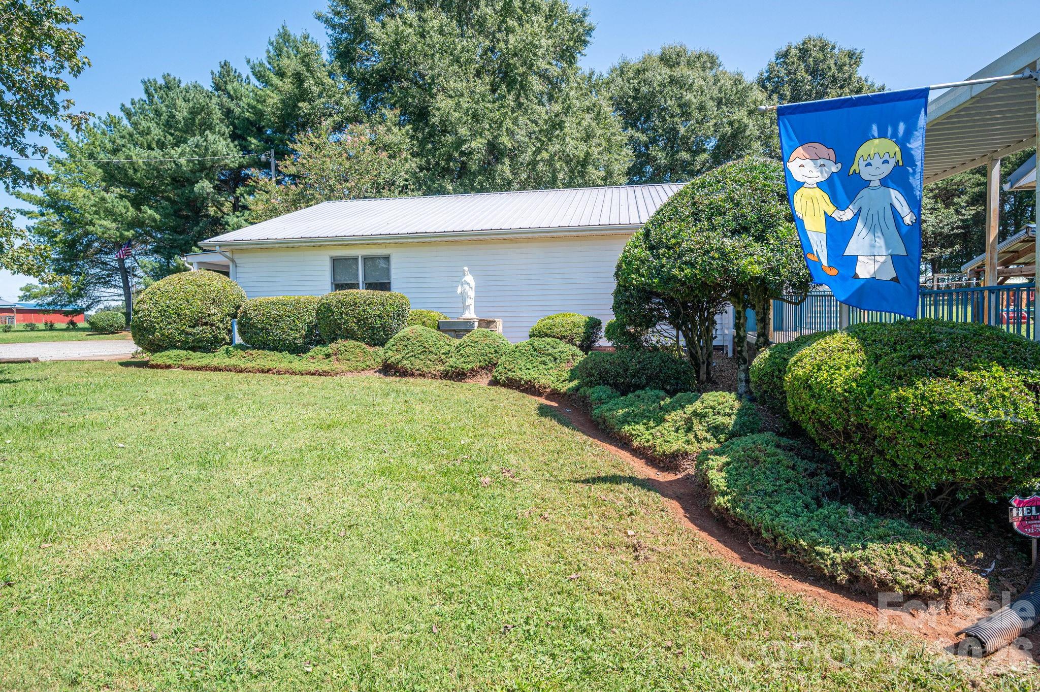 2482 June Bug Road Vale, NC 28168 - Photo 14 of 34 a view of a house with a yard and potted plants