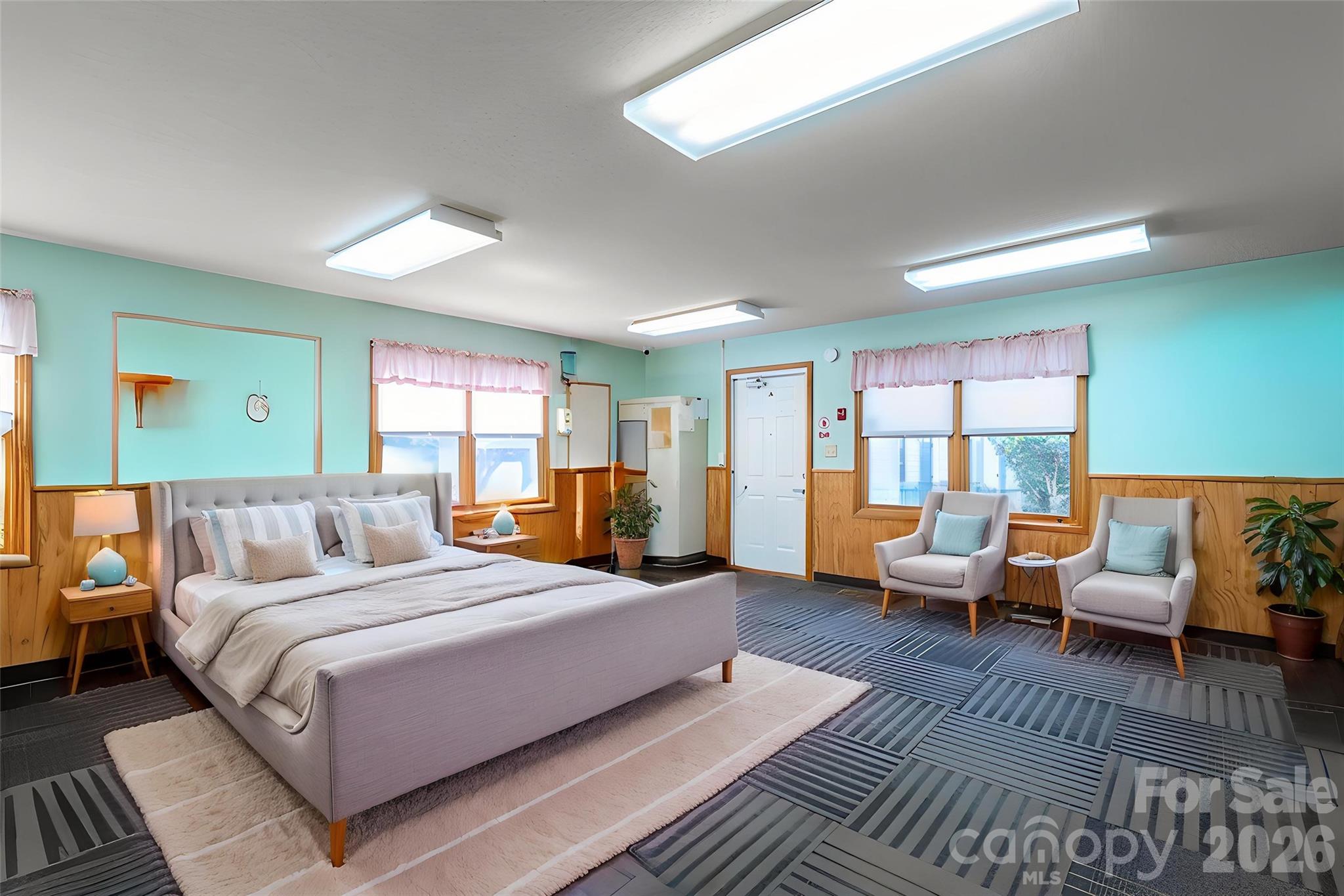 2482 June Bug Road Vale, NC 28168 - Photo 2 of 34 a bedroom with a large bed couch and windows