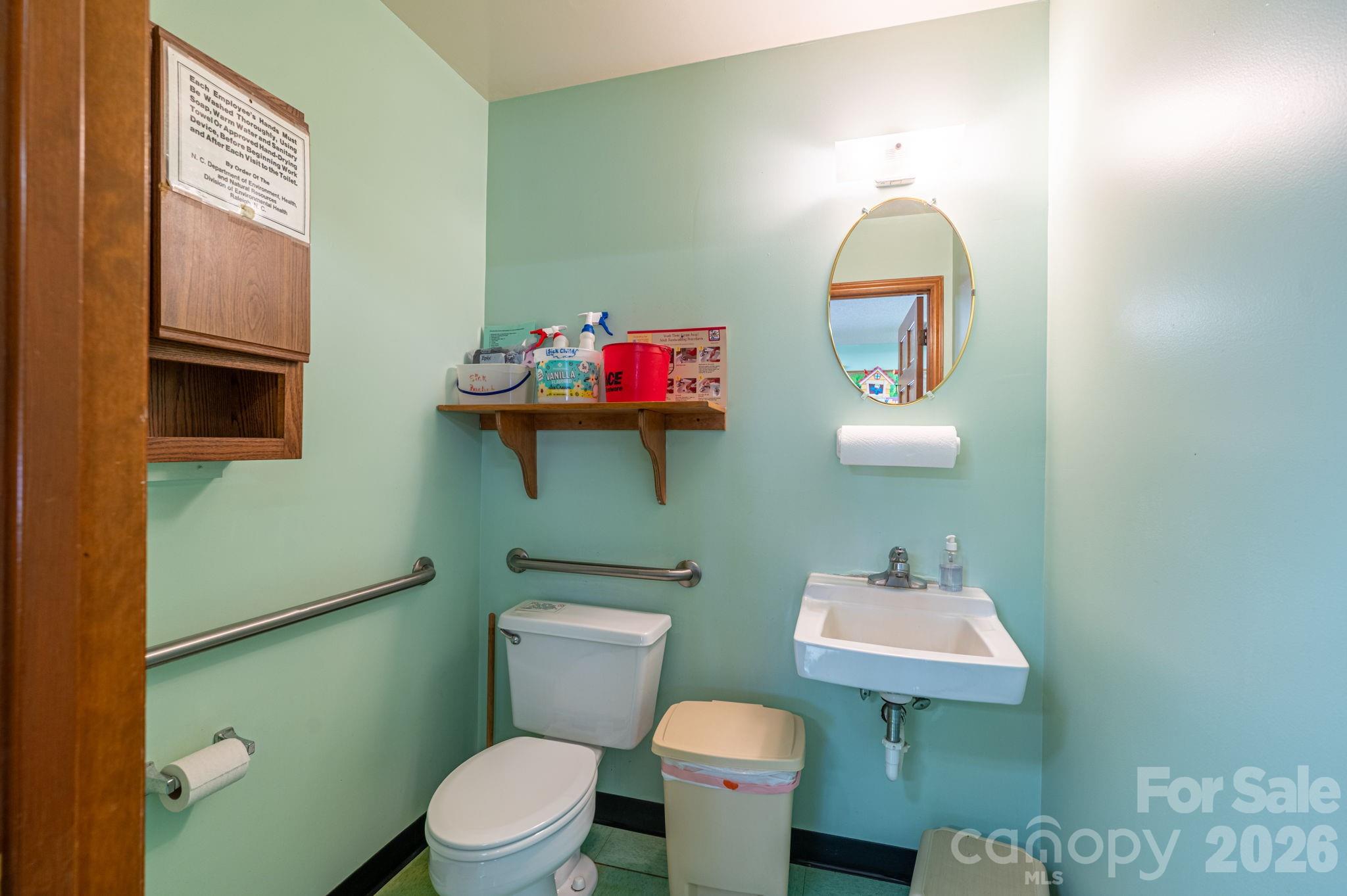 2482 June Bug Road Vale, NC 28168 - Photo 21 of 34 a bathroom with a toilet sink and mirror