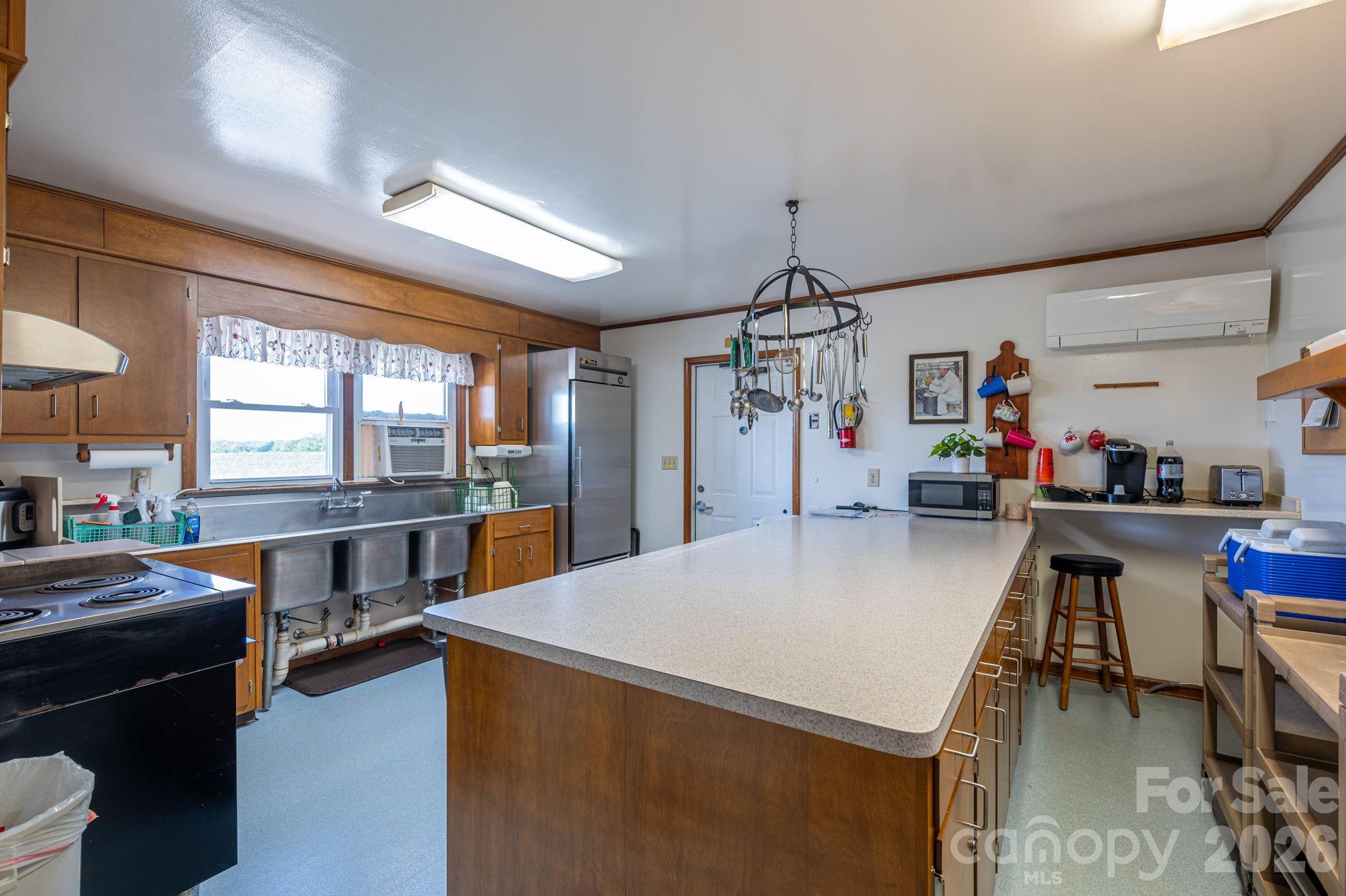 2482 June Bug Road Vale, NC 28168 - Photo 25 of 34 a view of a dining room with furniture and a kitchen view