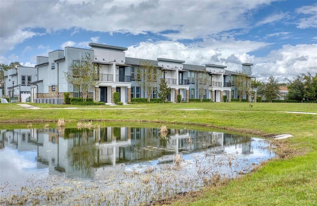 1801 Houston Street Kissimmee, FL 34743 - Photo 1 of 32 a view of a big building with a big yard and large trees