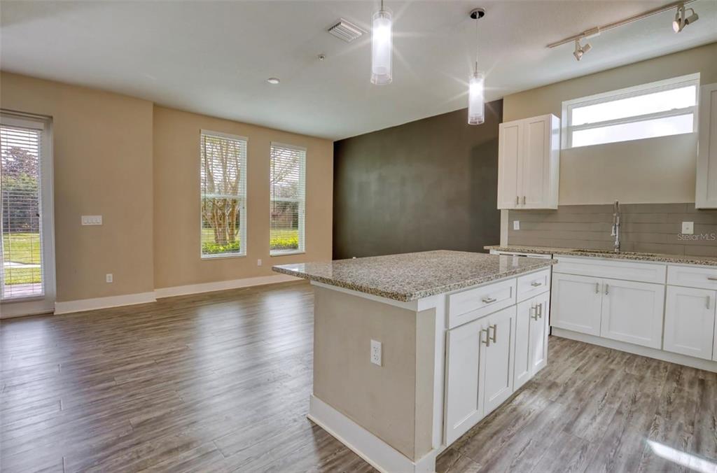 1801 Houston Street Kissimmee, FL 34743 - Photo 12 of 32 a kitchen with a stove and wooden floor