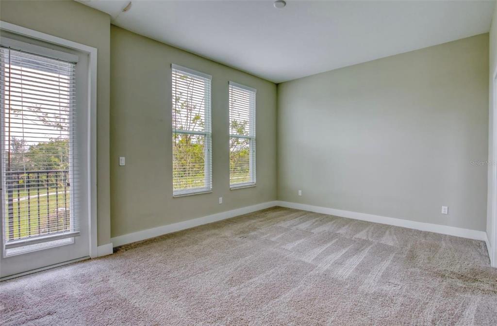 1801 Houston Street Kissimmee, FL 34743 - Photo 17 of 32 a view of an empty room with a window