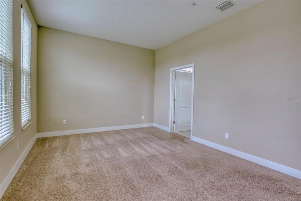 1801 Houston Street Kissimmee, FL 34743 - Photo 18 of 32 an empty room with a natural light