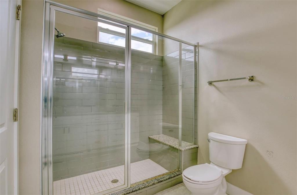 1801 Houston Street Kissimmee, FL 34743 - Photo 21 of 32 a bathroom with a toilet and a shower