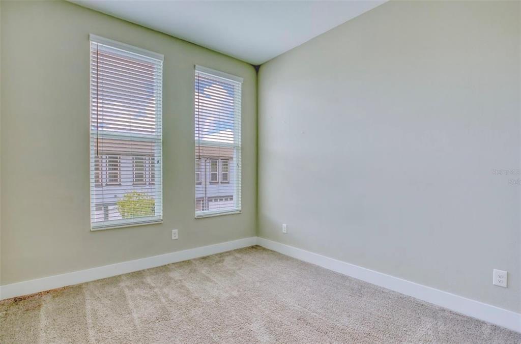 1801 Houston Street Kissimmee, FL 34743 - Photo 24 of 32 an empty room with a window