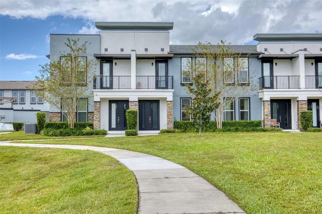 1801 Houston Street Kissimmee, FL 34743 - Photo 28 of 32 a front view of a building with a garden