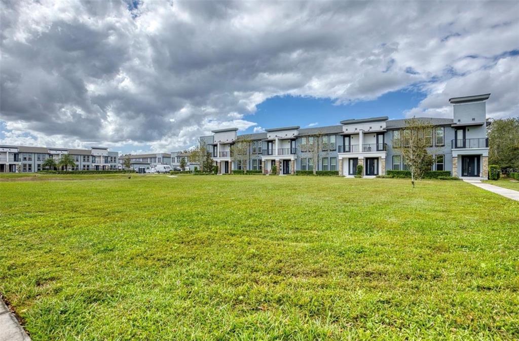 1801 Houston Street Kissimmee, FL 34743 - Photo 30 of 32 a view of a big room with a big yard and large trees