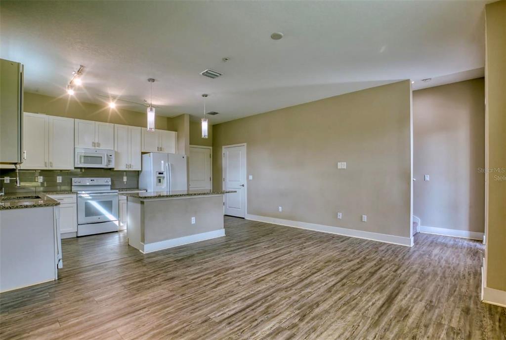 1801 Houston Street Kissimmee, FL 34743 - Photo 8 of 32 a view of kitchen and kitchen with stainless steel appliances