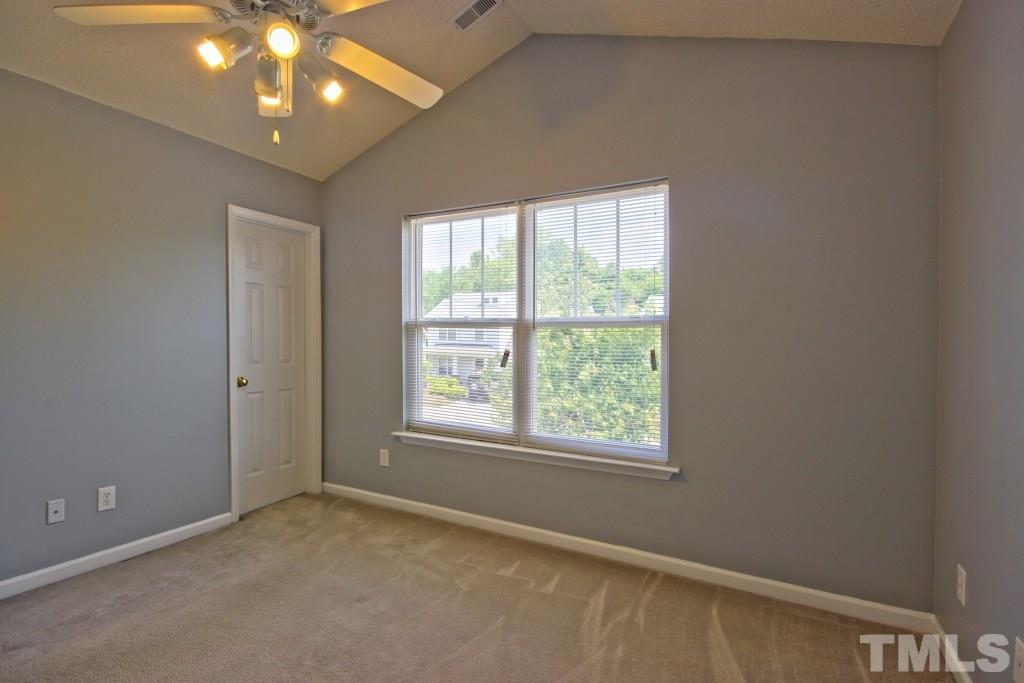 3800 Hopper Street Raleigh, NC 27616 - Photo 11 of 18 an empty room with a window and a fan