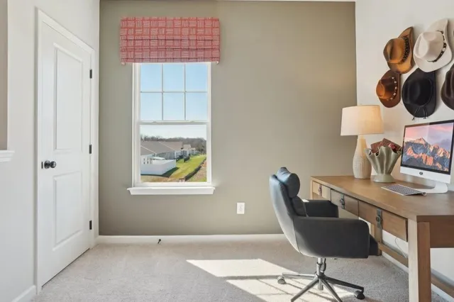 a workspace with furniture and window