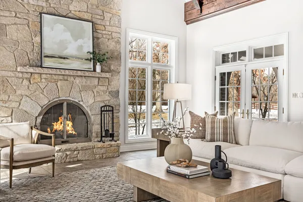 a living room with furniture fireplace and flat screen tv