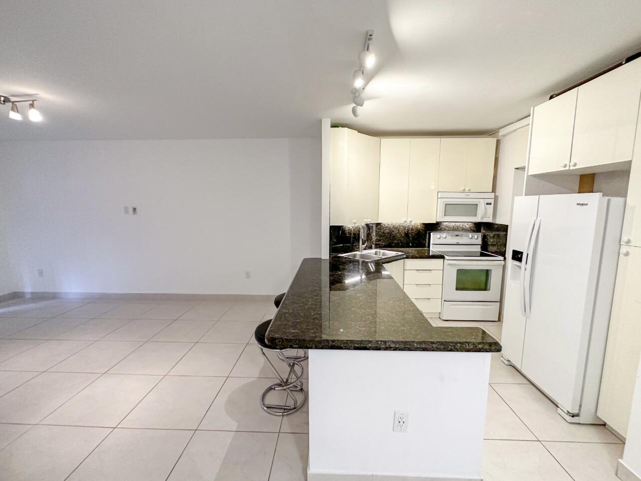 50 Southwest 3rd Avenue, Unit 1060 Boca Raton, FL 33432 - Photo 4 of 24 6. BCP 106F - Kitchen & Living Room