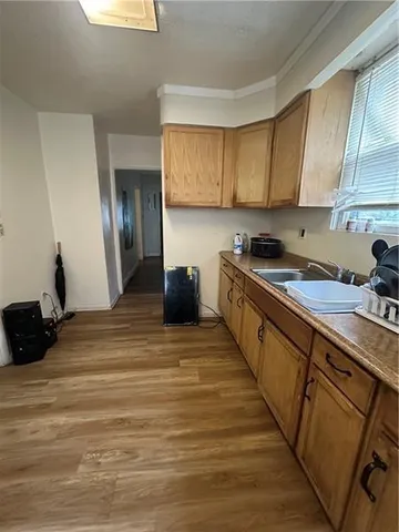 a kitchen with stainless steel appliances granite countertop a sink stove and cabinets