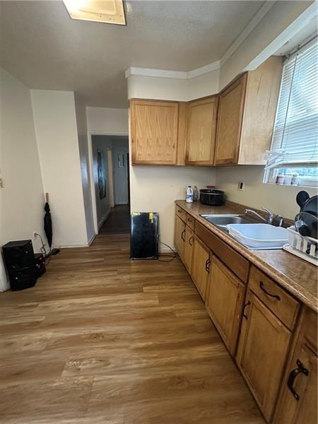 12 Elizabeth Street Pittsburgh, PA 15210 - Photo 12 of 32 a kitchen with stainless steel appliances granite countertop a sink stove and cabinets