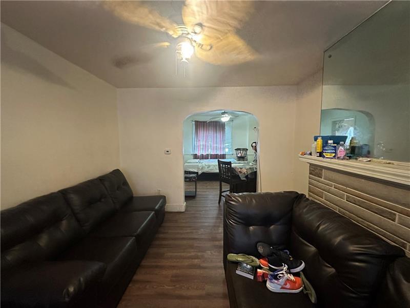 12 Elizabeth Street Pittsburgh, PA 15210 - Photo 14 of 32 a living room with furniture and a couch