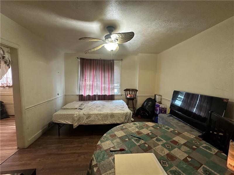 12 Elizabeth Street Pittsburgh, PA 15210 - Photo 16 of 32 a bedroom with two beds and a couch