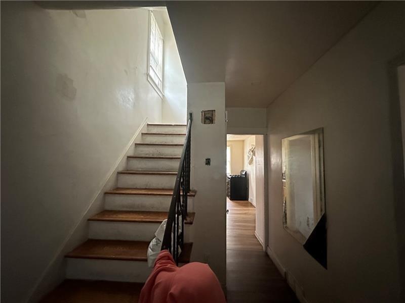 12 Elizabeth Street Pittsburgh, PA 15210 - Photo 27 of 32 a view of entryway and hall with wooden floor