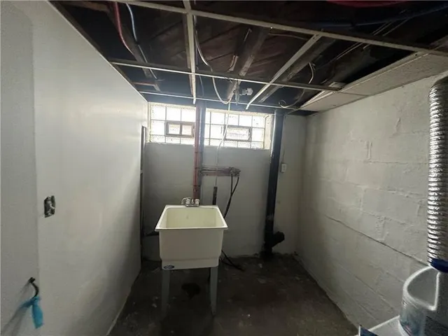 a view of a room with a table and chairs