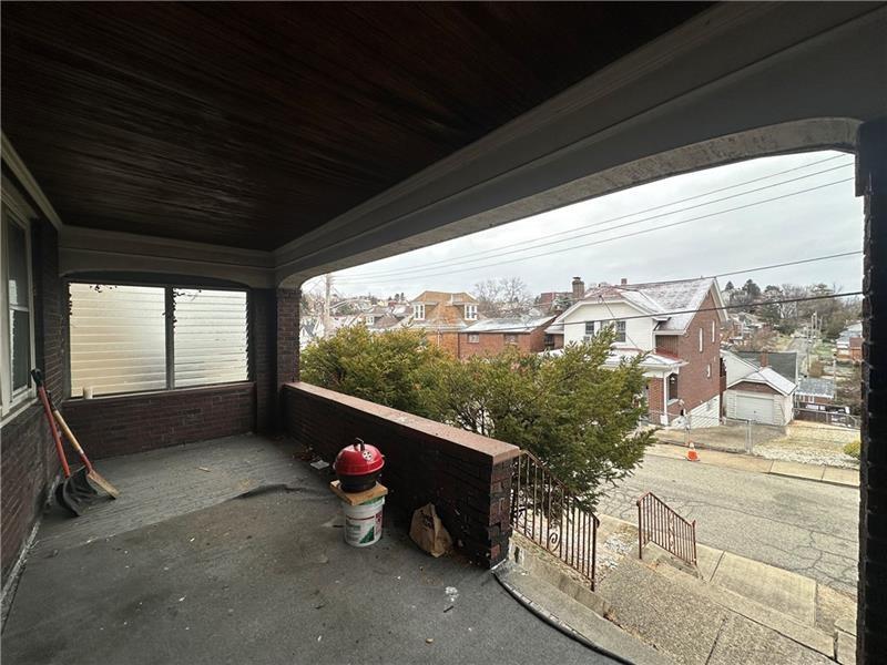 12 Elizabeth Street Pittsburgh, PA 15210 - Photo 4 of 32 a view of a room with wooden floor and outdoor space