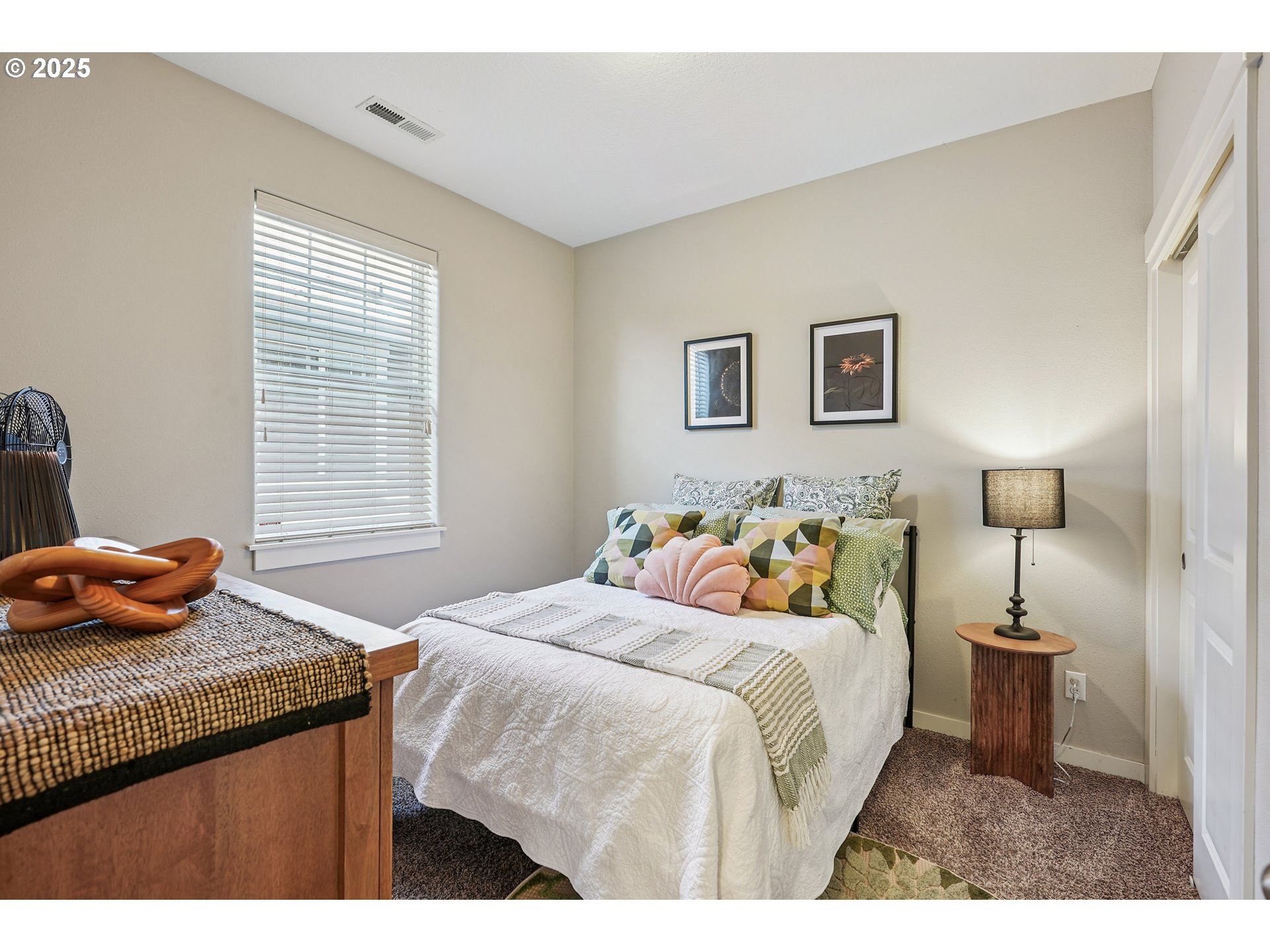 10130 Southeast Knight Street Portland, OR 97266 - Photo 22 of 33 a bedroom with a bed and a window