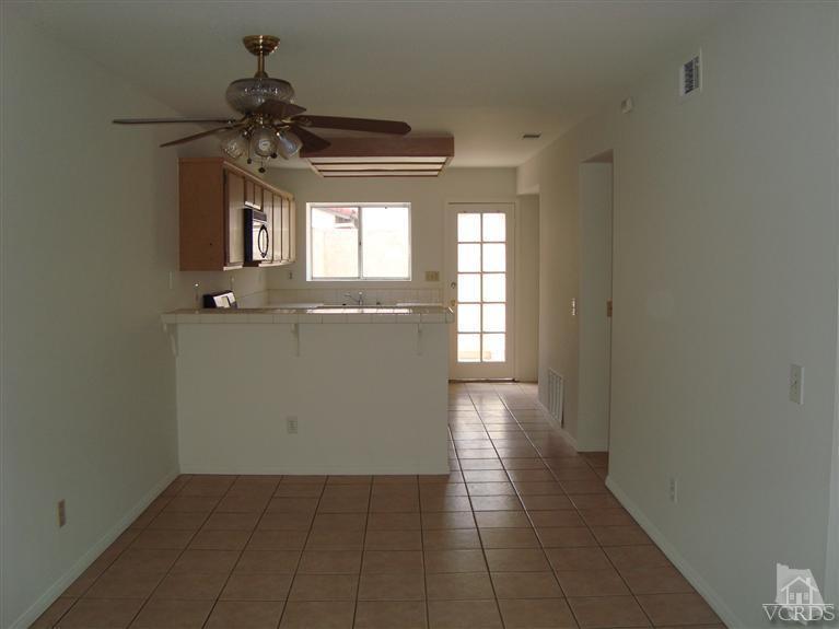 410 Johnson Road Oxnard, CA 93033 - Photo 3 of 10 a view of a hallway with a chandelier