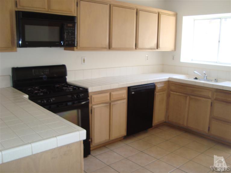 410 Johnson Road Oxnard, CA 93033 - Photo 5 of 10 a kitchen with sink cabinets and microwave