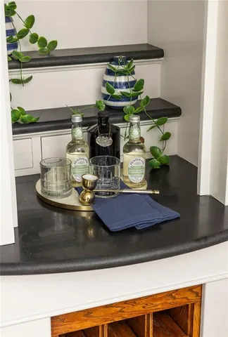 a view of a hallway view with wooden floor and staircase