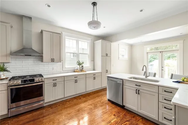 a bedroom with a bed a couch and a window