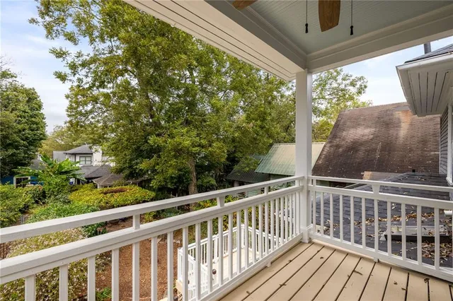 a front view of a house with a yard with outdoor seating