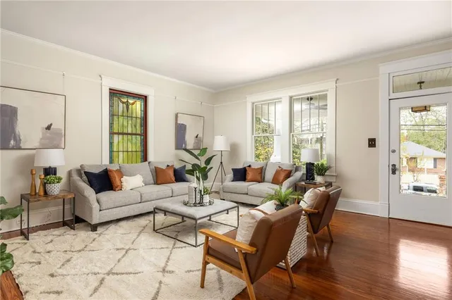 a view of a dining room with furniture window and wooden floor