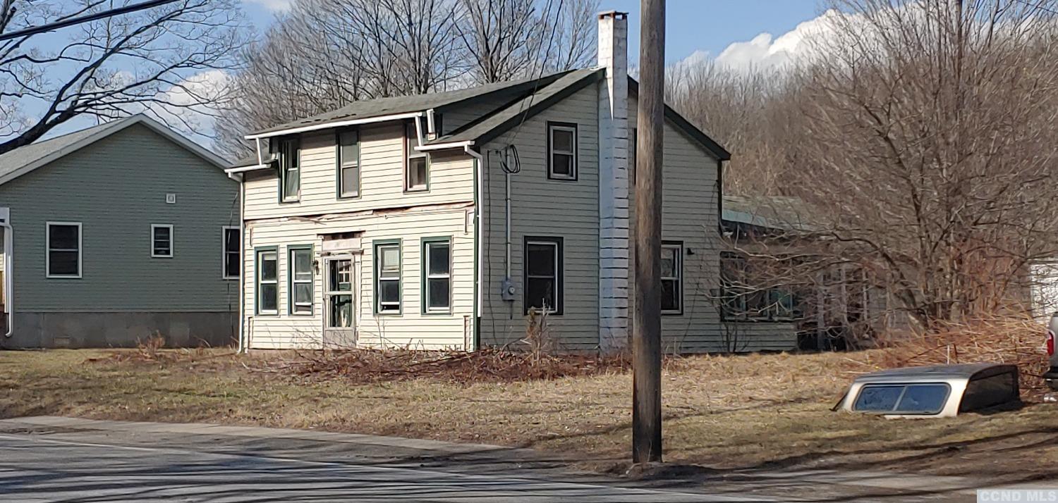 14438 Main Street Prattsville, NY 12468 - Photo 1 of 3 a front view of a house with parking space
