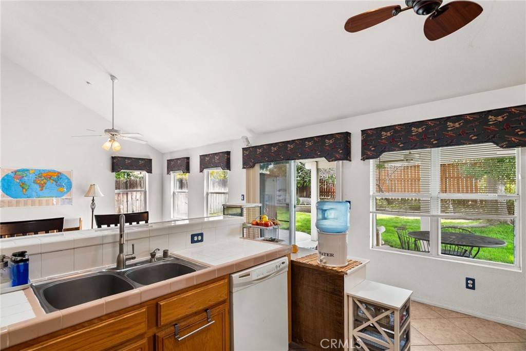 944 Riverview Drive Redlands, CA 92374 - Photo 11 of 32 a kitchen with counter top space and windows