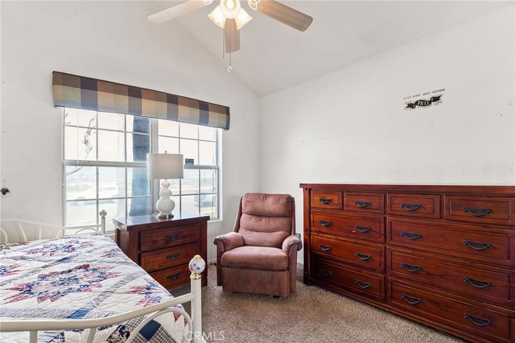 944 Riverview Drive Redlands, CA 92374 - Photo 13 of 32 a bedroom with a bed and a couch