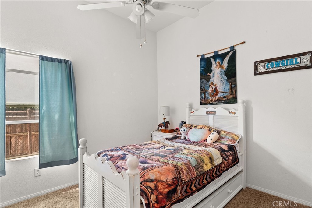 944 Riverview Drive Redlands, CA 92374 - Photo 19 of 32 a bedroom with a bed and a window