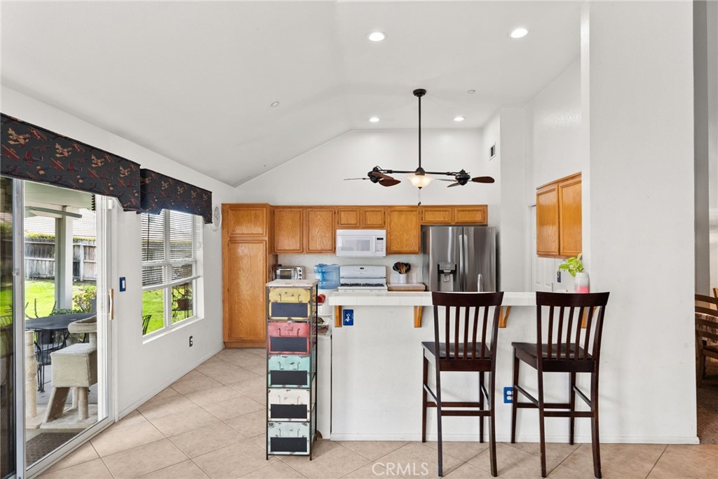 944 Riverview Drive Redlands, CA 92374 - Photo 8 of 32 a open dining room with stainless steel appliances furniture large window and wooden floor