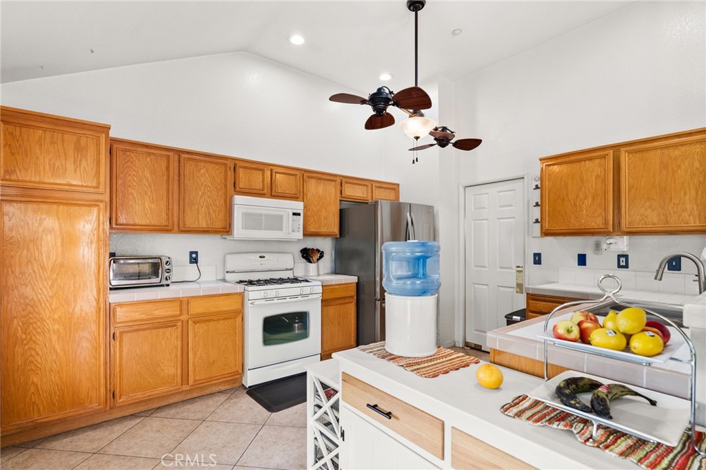944 Riverview Drive Redlands, CA 92374 - Photo 9 of 32 a kitchen that has a cabinets and a stove