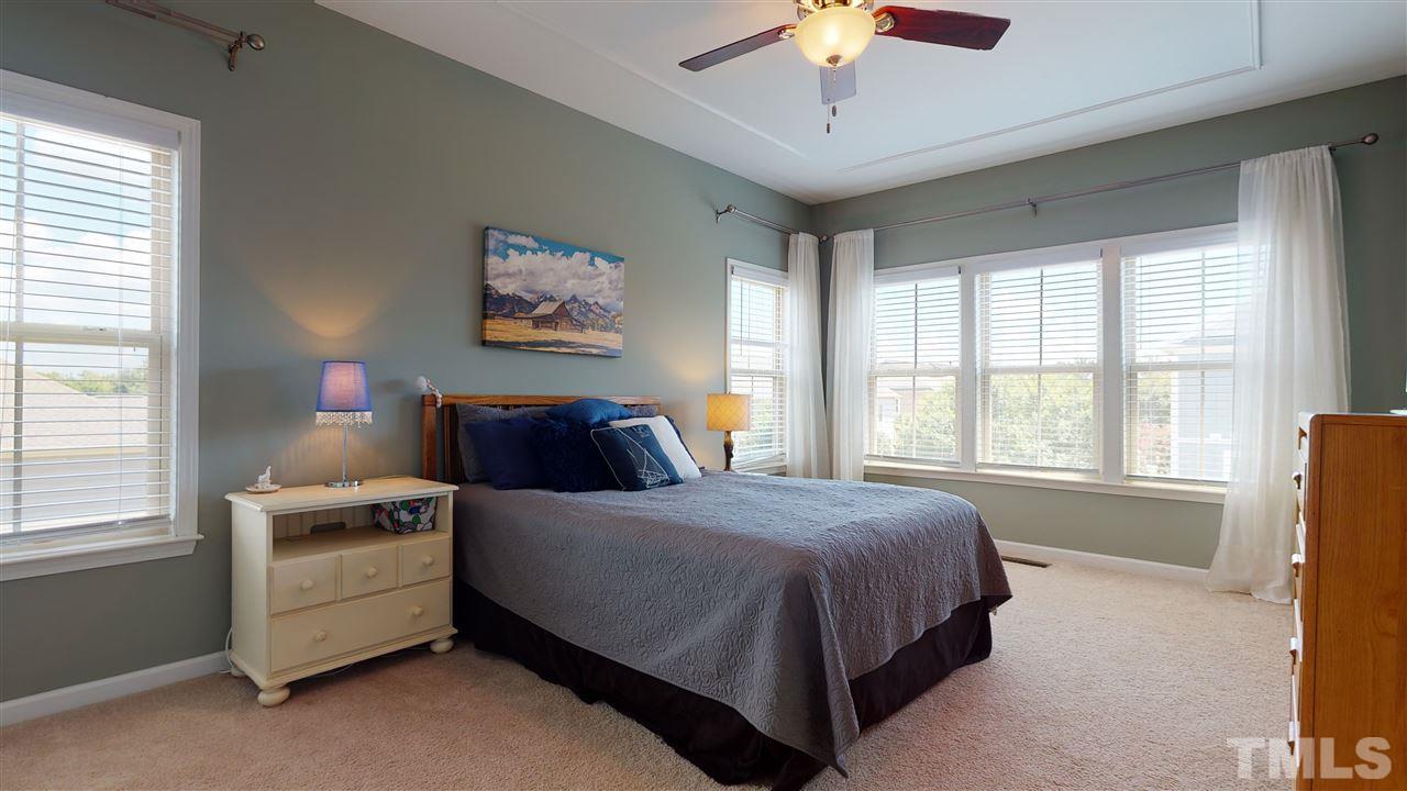 1329 Rembrandt Circle Raleigh, NC 27607 - Photo 12 of 23 a bedroom with bed and a large window