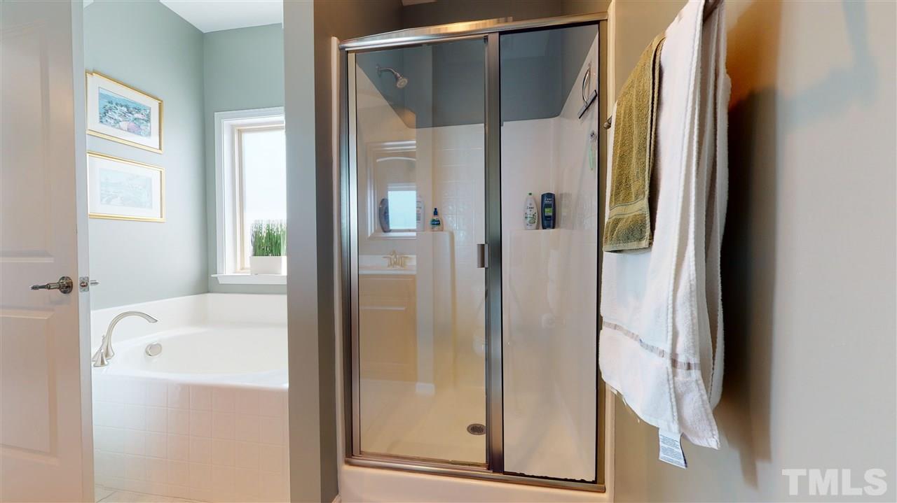 1329 Rembrandt Circle Raleigh, NC 27607 - Photo 14 of 23 a bathroom with a bathtub and a shower