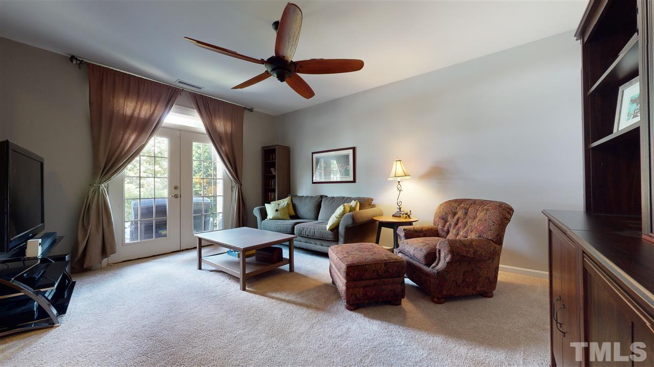 1329 Rembrandt Circle Raleigh, NC 27607 - Photo 3 of 23 a living room with furniture a ceiling fan and a window