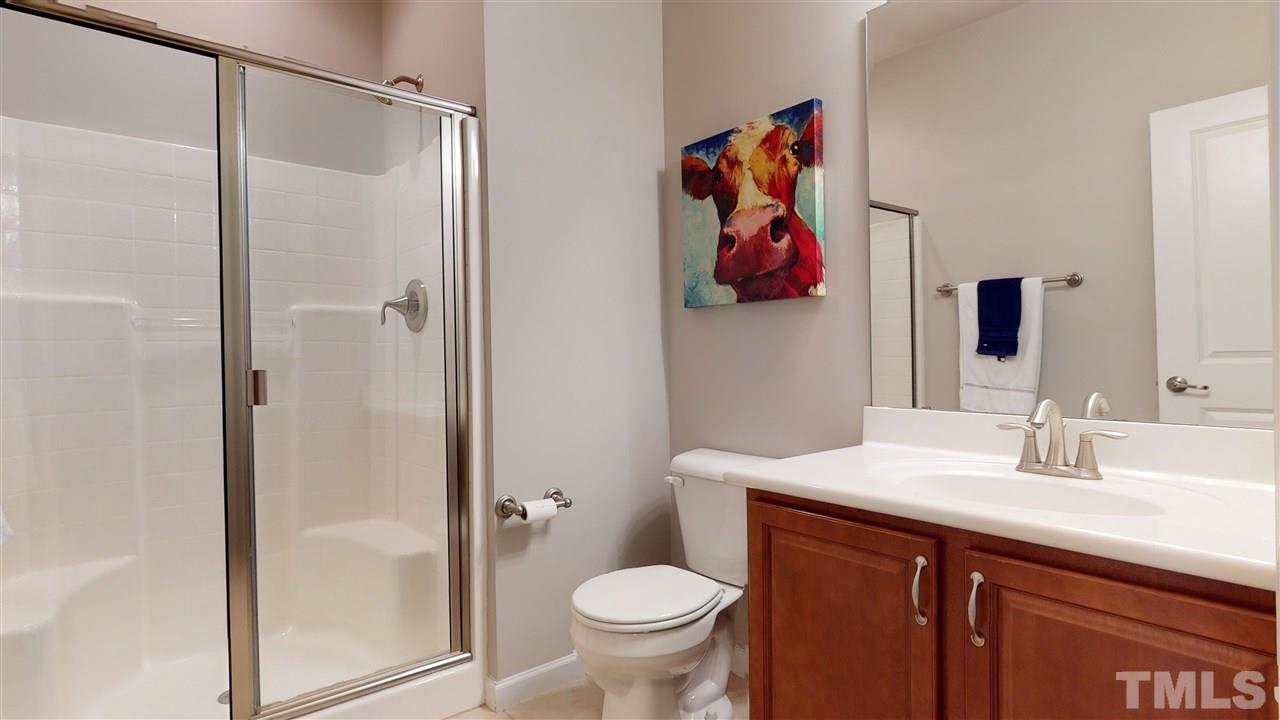 1329 Rembrandt Circle Raleigh, NC 27607 - Photo 5 of 23 a bathroom with a toilet sink and vanity