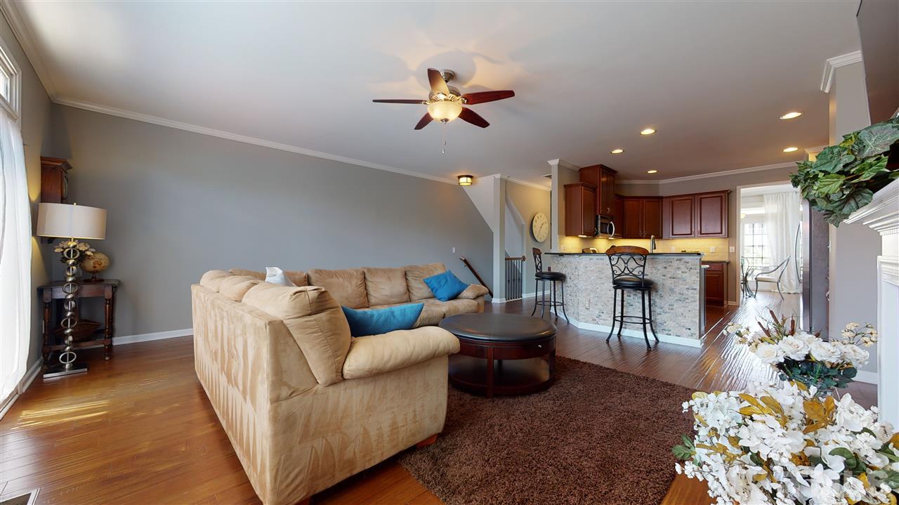 1329 Rembrandt Circle Raleigh, NC 27607 - Photo 6 of 23 a living room with furniture and kitchen view