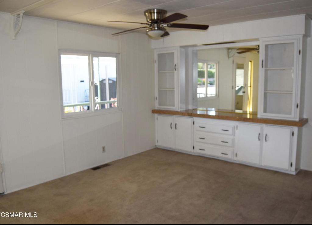 195 Tierra Rejada Road, Unit 197 Simi Valley, CA 93065 - Photo 5 of 28 a view of a bathroom with cabinet and mirror